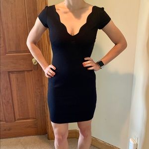 Scalloped neck black mini dress